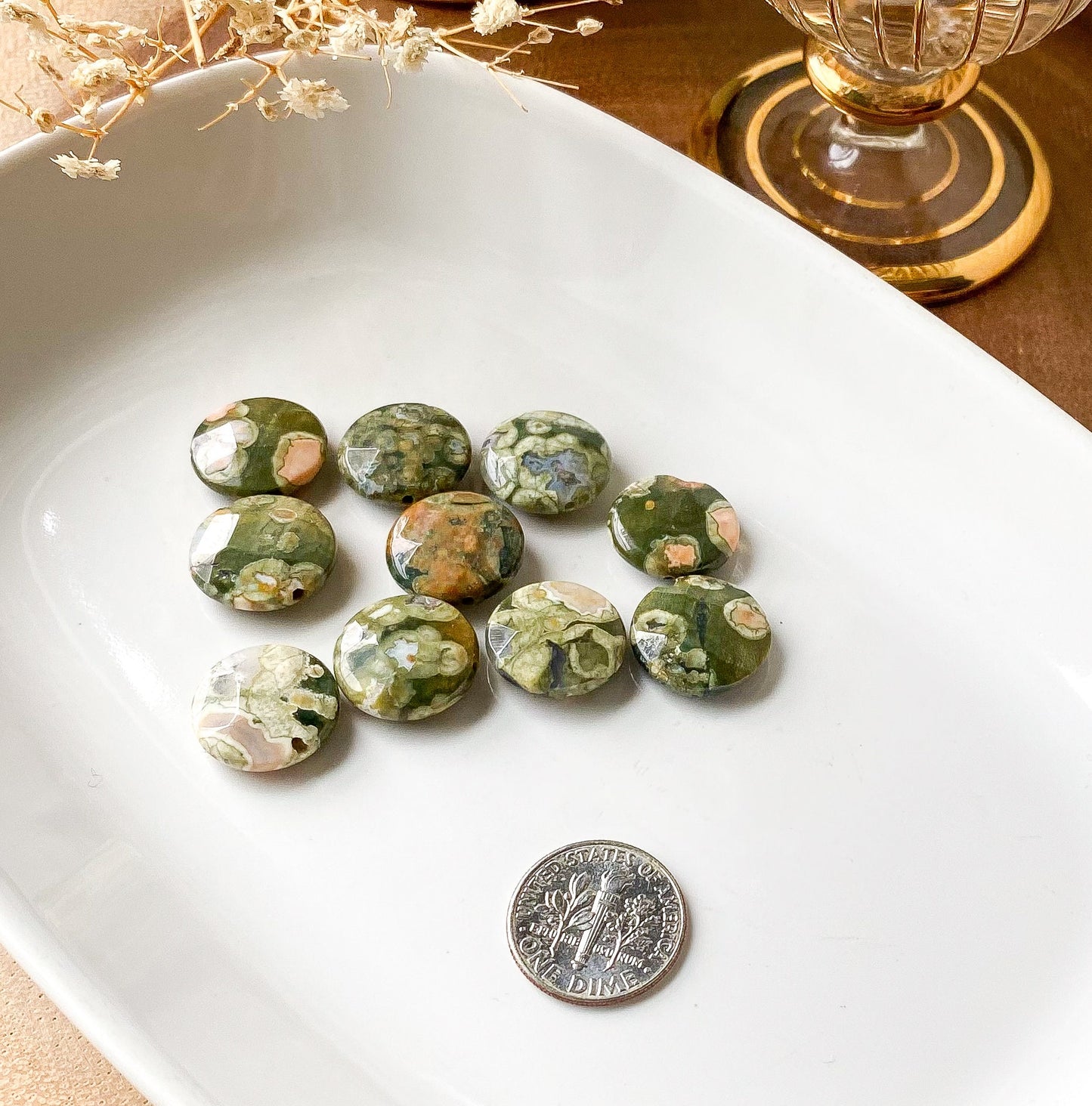 a pile of marbles sitting on top of a white plate