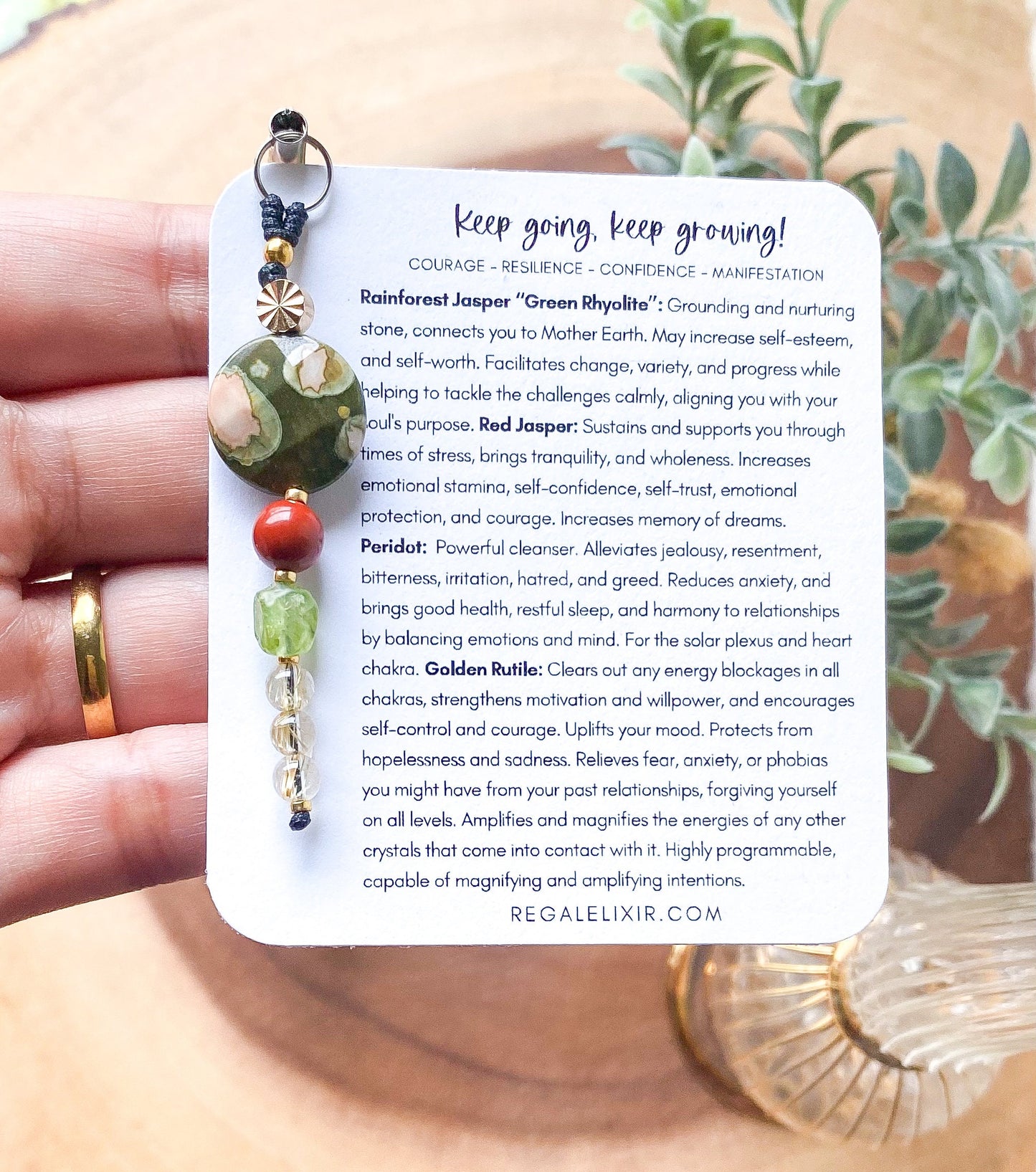 a person holding a card with a ring on it