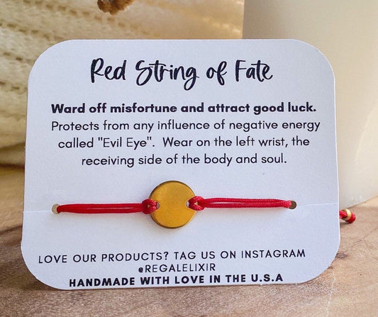 Red string bracelet with gold charm